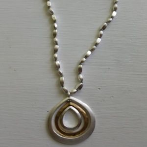 Kenneth Cole pendant on Silver beaded necklace